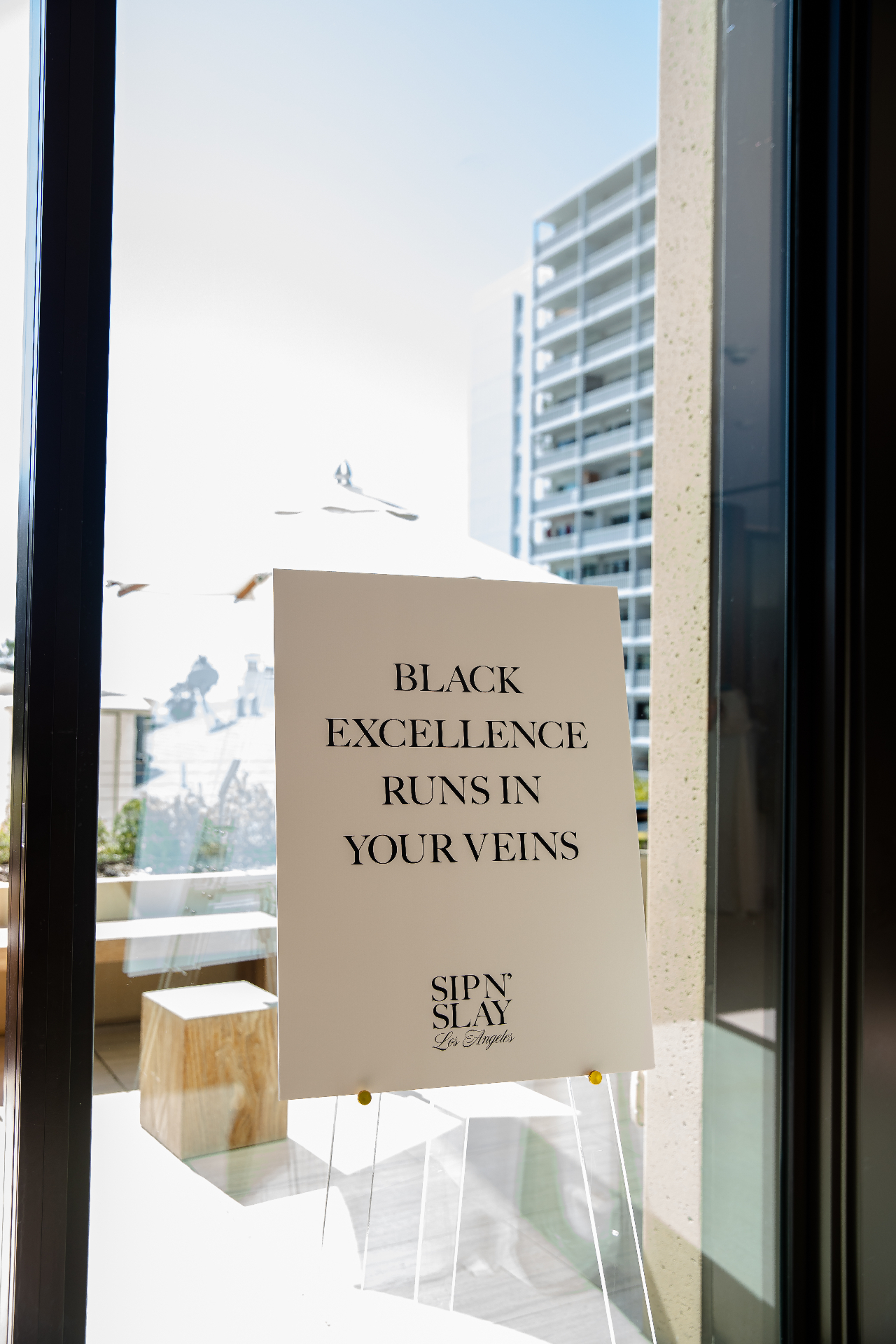 Sip N' Slay — Black Excellence signage